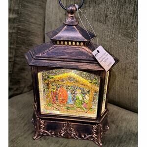 Gerson 10.5” Nativity scene snow globe lantern lights up and sings